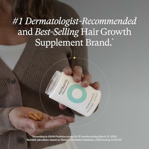 Person holding a bottle of hair growth supplements.